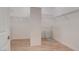 Walk-in closet with wooden floors, white walls and shelving units ready for the new homeowner at 17 Stonemark Dr, Henderson, NV 89052