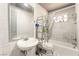 View of bathroom with a white tiled shower and floor at 1708 Weeping Willow Ln, Las Vegas, NV 89104