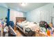 View of a bedroom with a light blue painted walls and floors at 1708 Weeping Willow Ln, Las Vegas, NV 89104