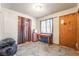 View of a bedroom with a table and a small window at 1708 Weeping Willow Ln, Las Vegas, NV 89104