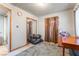View of a bedroom with a mirrored closet doors and a small window at 1708 Weeping Willow Ln, Las Vegas, NV 89104