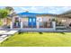 Charming home featuring a well-maintained lawn and inviting blue double door entrance at 1708 Weeping Willow Ln, Las Vegas, NV 89104