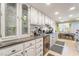 Bright kitchen featuring white cabinets, granite countertops, and stainless steel appliances at 1708 Weeping Willow Ln, Las Vegas, NV 89104