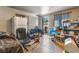 Inside view featuring tile floors and basic furnishings, including a sofa and shelving at 1708 Weeping Willow Ln, Las Vegas, NV 89104