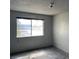 Bedroom with neutral colored walls, carpet and a window with exterior views at 204 Bradshaw Way, Las Vegas, NV 89145