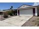 A single-story home showing a wide driveway and desert landscaping at 204 Bradshaw Way, Las Vegas, NV 89145