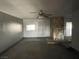 Interior view of a living room with a stone fireplace and neutral walls at 204 Bradshaw Way, Las Vegas, NV 89145