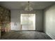 Spacious living room features a stone fireplace and sliding glass doors at 204 Bradshaw Way, Las Vegas, NV 89145