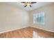 This bedroom features hardwood floors, a ceiling fan, and plantation shutters for a cozy yet elegant feel at 2152 Mountain City St, Henderson, NV 89052