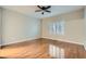 Bedroom featuring hardwood flooring, ceiling fan, neutral walls, and plantation shutters at 2152 Mountain City St, Henderson, NV 89052
