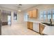 View of kitchen with tile flooring, ceiling fan, stainless steel sink, and white appliances at 2152 Mountain City St, Henderson, NV 89052