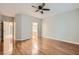 Spacious primary bedroom featuring hardwood floors, ceiling fan, and neutral walls at 2152 Mountain City St, Henderson, NV 89052