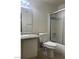 Bathroom with a toilet, shower with glass door, vanity, and granite countertop at 220 Mission Newport Ln # 201, Las Vegas, NV 89107