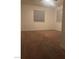Cozy bedroom featuring neutral carpet, ceiling fan, and window bringing in natural light at 220 Mission Newport Ln # 201, Las Vegas, NV 89107