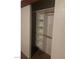Open closet features adjustable shelving and hanging rods at 220 Mission Newport Ln # 201, Las Vegas, NV 89107
