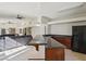 Open-concept kitchen and living area with a breakfast bar and modern appliances at 220 Mission Newport Ln # 201, Las Vegas, NV 89107
