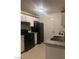 Efficient kitchen with granite countertops and black appliances, ready for cooking at 220 Mission Newport Ln # 201, Las Vegas, NV 89107