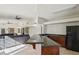Open concept kitchenette with black appliances and granite countertops at 220 Mission Newport Ln # 201, Las Vegas, NV 89107