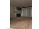 Cozy living room features a fireplace, TV, and window with modern blinds at 220 Mission Newport Ln # 201, Las Vegas, NV 89107