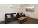 Cozy living room with comfortable seating and a wall-mounted TV at 220 Mission Newport Ln # 201, Las Vegas, NV 89107