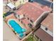 Aerial view of home with a large pool and patio area, set on a well-maintained lot at 227 Palmarosa St, Henderson, NV 89015