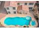 Aerial view of home showcasing a large pool with rock features and lush landscaping at 227 Palmarosa St, Henderson, NV 89015