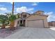 Inviting two-story home showcasing a two-car garage and desert-friendly landscaping at 227 Palmarosa St, Henderson, NV 89015