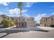 Attractive home featuring drought-tolerant landscaping and an attached two-car garage at 227 Palmarosa St, Henderson, NV 89015