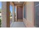 Close-up of a private front door with portico and privacy window at 227 Palmarosa St, Henderson, NV 89015
