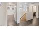 Upstairs hallway with wood floors and wood railing at 227 Palmarosa St, Henderson, NV 89015