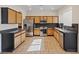 Well-equipped kitchen features stainless appliances, stylish cabinets, and tile flooring at 227 Palmarosa St, Henderson, NV 89015