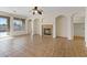 Open-concept living room with fireplace and access to the backyard pool at 227 Palmarosa St, Henderson, NV 89015