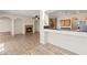 Open-concept living space with view of the kitchen and fireplace at 227 Palmarosa St, Henderson, NV 89015