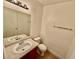 Compact bathroom features a clean sink, a toilet, and a mirror with vanity lighting at 2524 Charleville Ave # 102, Las Vegas, NV 89106
