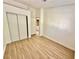 Light and airy bedroom features sleek flooring, closet with sliding doors and attached bathroom at 2524 Charleville Ave # 102, Las Vegas, NV 89106
