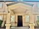 Inviting front entrance with a covered porch and decorative columns at 2524 Charleville Ave # 102, Las Vegas, NV 89106