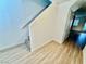 Hallway with staircase leading to upper floors and wood-look flooring throughout at 2524 Charleville Ave # 102, Las Vegas, NV 89106