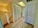 Hallway on the upper level with closet space, natural light, and wood-look flooring at 2524 Charleville Ave # 102, Las Vegas, NV 89106