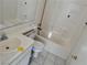 Bathroom featuring tiled walls, a vanity sink, toilet, and a bathtub at 2803 Exulted Valley Ave, North Las Vegas, NV 89032