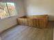 Bedroom with hardwood flooring, and one window offering natural light at 2803 Exulted Valley Ave, North Las Vegas, NV 89032