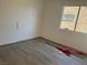Bedroom featuring neutral walls, modern laminate flooring, and natural lighting at 2803 Exulted Valley Ave, North Las Vegas, NV 89032