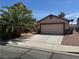 Charming single-story home with a two-car garage and a well-maintained desert landscaped yard at 2803 Exulted Valley Ave, North Las Vegas, NV 89032