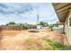 Spacious backyard with trampoline, a covered patio and partial fencing at 2825 Berg St, North Las Vegas, NV 89030