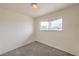 Bedroom showcasing a window, neutral carpet, and white walls providing a blank canvas at 2825 Berg St, North Las Vegas, NV 89030