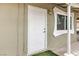 Close-up of the home's front door and adjacent window at 2825 Berg St, North Las Vegas, NV 89030