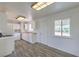 Bright kitchen with white cabinets, appliances, and durable vinyl flooring at 2825 Berg St, North Las Vegas, NV 89030