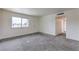Bright living room featuring new carpet and fresh white walls at 2825 Berg St, North Las Vegas, NV 89030