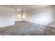 Spacious living room with neutral carpet, fresh white walls, and natural light at 2825 Berg St, North Las Vegas, NV 89030
