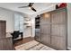 Cozy bedroom featuring a murphy bed, desk, and a ceiling fan for a modern appeal at 305 Rezzo St, Las Vegas, NV 89138
