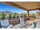 Outdoor patio with seating area offering views of the desert mountains at 305 Rezzo St, Las Vegas, NV 89138
